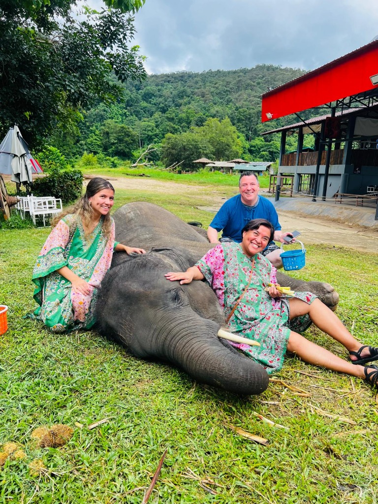 Ethical elephant sanctuary feeding and bonding moment
