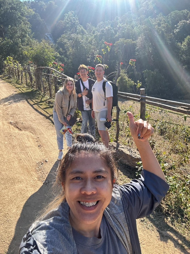 Nature trail hike under sun rays in northern Thailand