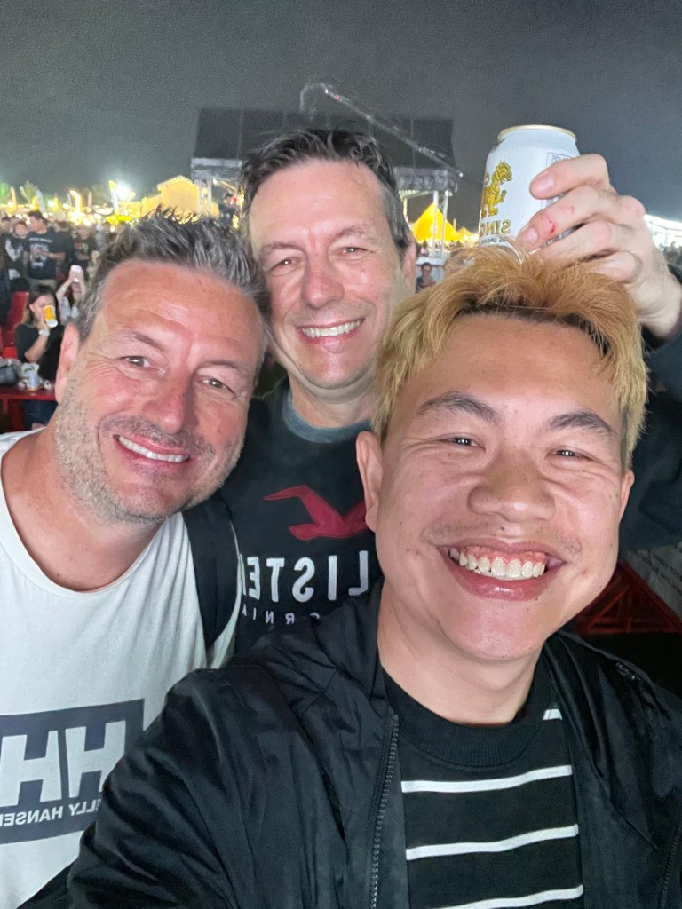 Exciting evening music festival party with international friends