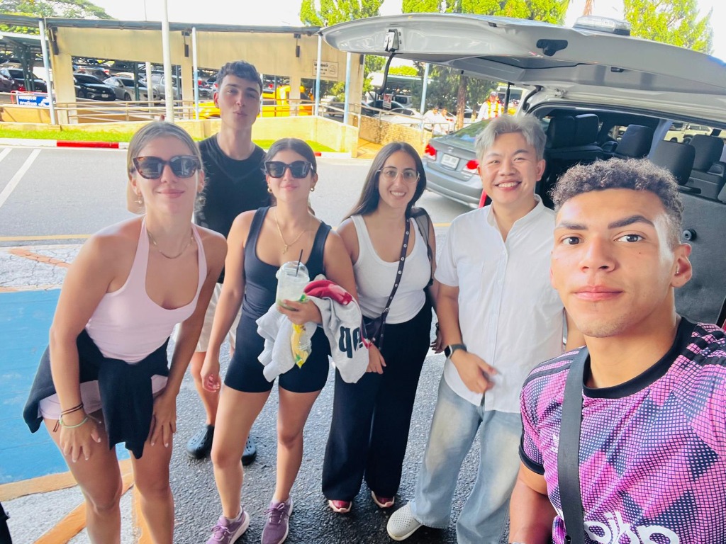Group of happy friends ready for roadtrip with VIP van