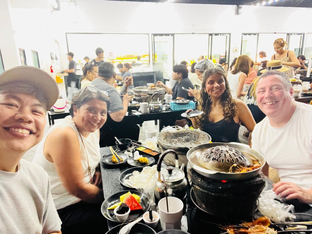 Authentic Thai BBQ Mookata dinner with happy guests